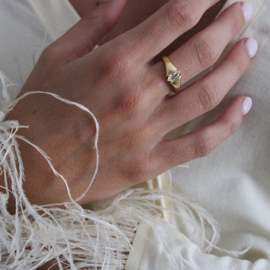 Gold filled ring with adjustable sizing on a woman's hand